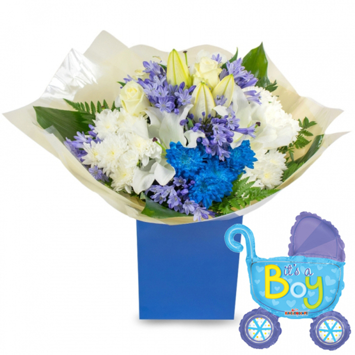 A carefully composed welcoming set intended for a newborn son: a lush, round bouquet overflowing with pristine white roses, elegant white lilies-some still in bud-and fluffy white chrysanthemums that provide a soothing, classic base. Interspersed among the whites are vivid electric-blue chrysanthemums that draw the eye and small clusters of lavender to periwinkle, bell-shaped blooms that add softness and subtle fragrance. Rich green foliage, from broad leaves to fine fern fronds, frames the petals and gives the composition depth and movement. The stems are wrapped in crinkled, translucent cream-coloured paper that picks up the light, and the arrangement sits inside a deep royal-blue rectangular gift box whose clean edges lend a modern, gift-like feel. To the right floats a light-blue foil balloon shaped like an old-fashioned baby carriage, its canopy and wheels accented in darker blue polka dots and tiny hearts, and the words It's a Boy written across the side in cheerful yellow and lime-green script. In the quiet early light the bouquet gives off a gentle, green-tinged floral scent-rose and lily with a hint of hyacinth-perfect for presenting at a new-baby visit to a flat near Essex Road, a meet-and-greet at Canonbury Square or a cheerful delivery across Islington. As an experienced local florist, Canonbury Flowers often crafts this classic blue-and-white combination to convey celebration, tenderness and the warm welcome every newborn deserves.