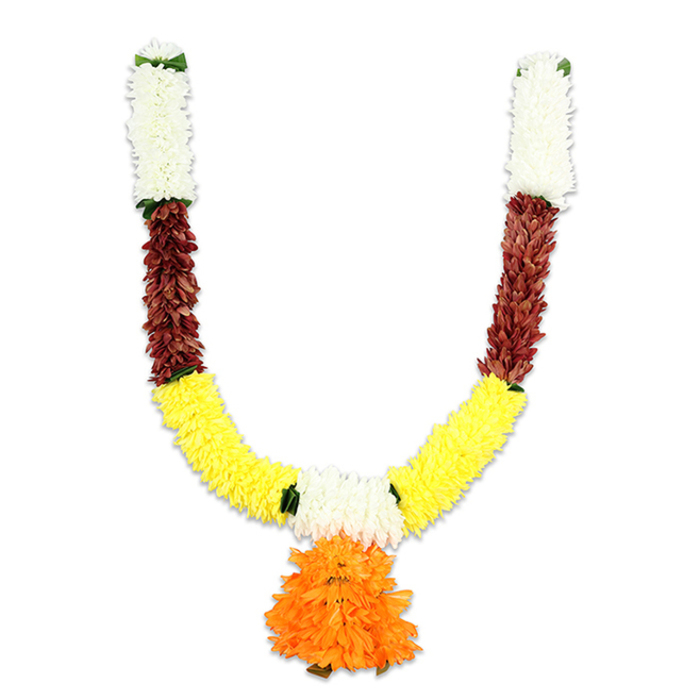 Displayed against a pure white background, this handcrafted U-shaped garland presents a study in colour modulation and material craft. The topmost sections of each arm are composed of compact, cream-coloured flowerettes-small, cushiony clusters that mimic chrysanthemums or miniature carnations-finished with a faint dark-green cap at the very apex. Immediately beneath, a contiguous band of deep reddish-brown forms a textured midsection; these pieces appear deliberately flattened and layered, suggesting the visual weight of dried petals or mahogany-toned fabric petals that stabilise the design. The lower curve is dominated by a dense run of bright yellow blooms, arranged to emulate traditional marigolds (genda phool) with tightly packed, pom-pom profiles that provide volume and movement. At the junctions between colour blocks, vivid green hints-either artificial leaflets or ribbon ties-accentuate the transitions and reinforce the hand-threaded construction. Hanging where the two arms converge is a voluminous pendant of orange ruffles: multi-layered, full, and graduated in tone from deep orange at the base to lighter warm hues above, creating a cascading focal element. Materially, the garland reads as high-quality artificial fibres-silk-like petals and bundled cores secured on a concealed cord-designed for durability and repeated ceremonial use. Under soft studio lighting each colour is saturated yet distinct, the white space around it sharpening the silhouette. This traditional toran is designed for temple decoration, puja altars, wedding thresholds, or festival doorways and would sit comfortably in homes and community halls across Canonbury and neighbouring Islington, offering a washable, long-lasting alternative to fresh flower garlands while keeping all the customary symbolism intact.