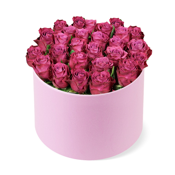 An aristocratic bloom statement from Canonbury Flowers: dozens of tightly packed deep pink roses form a rounded dome within a light pink cylindrical hat box, the minimalist finish of the container balancing the lush abundance above. The roses' petals display a subtle gradient-from pale pink centers to jewel-toned magenta edges-while the compact arrangement keeps every bloom in close concert. A whisper of dark green foliage threads between the heads, just enough to lend contrast without stealing focus from the flowers. The composition is captured from a slightly elevated angle on a crisp white background, ensuring the box, its texture, and the rose-saturated palette read cleanly and boldly. This bouquet radiates romance, luxury, and celebration-an impeccable choice for Valentine's celebrations, engagements, or a refined dinner-party centerpiece. In Canonbury and the surrounding borough, Canonbury Flowers crafts pieces like this for discerning customers, with reliable delivery across Canonbury, Islington, and nearby streets such as Upper Street, Barnsbury, and Essex Road; same-day delivery is often available. The result is modern elegance with a timeless feel, a gift that complements contemporary interiors while carrying a classic floral language of affection.