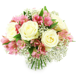 A rounded, hand-tied bouquet of creamy white roses, pink alstroemeria, and delicate baby's breath is shown against a spotless white background, glowing as though it has just been arranged in a calm Canonbury flower shop. Several full-headed white roses sit proudly across the top of the design, their petals layered in soft spirals that reveal a hint of pale yellow right at the centre, like candlelight deep within each bloom. Tucked between them, stems of alstroemeria unfurl their small trumpet flowers in shades of rose pink and fuchsia, with darker streaks and freckles marking each petal, giving a sense of movement and playful detail. Tiny white Gypsophila blossoms are sprinkled generously throughout, forming misty halos around the more substantial flowers, so the whole bouquet feels light and airy despite its generous size. The foliage is a rich, glossy green, emerging in pockets from beneath the blossoms to give depth and a natural, garden-picked character, similar to walking through the green spaces near Canonbury Square or along the tree-lined paths toward Highbury Fields. The stems at the base are neatly aligned and tightly bound, creating a clean, professional finish that indicates this arrangement is ready to be dropped into a vase on a dining table or sideboard. Soft, even lighting highlights subtle shadows between the petals and the crisp edges of each bloom, giving the design a serene, polished look. This bouquet radiates quiet affection and thoughtful celebration, perfect for a birthday, a heartfelt thank you, or a romantic surprise delivered to homes and offices throughout Canonbury, Islington, and neighbouring North London streets.