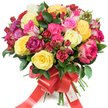 A luxurious, hand-tied bouquet of premium roses photographed against a clean white backdrop, arranged in a full, domed shape that reads abundant and celebratory. The palette is deliberately joyful: sunlit bright yellow roses sit beside creamy ivory blooms, while a spectrum of pinks moves from soft blush through vivid fuchsia to cherry and magenta, including a few bicolored petals edged in pink-and-white. Deep burgundy and true crimson roses-and tighter, clustered spray roses-anchor the composition with dramatic depth. Textural contrast comes from the mix of large, open hybrid tea roses, smaller spray roses and delicate, tight rosebuds that spiral outward; each petal appears velvety, slightly dewy, and layered to catch the light. Glossy dark-green foliage, likely ruscus or salal, is woven through the stems, its smooth leaves providing a verdant frame that makes the colours sing. At the base the stems are neatly gathered and tied with a wide red satin ribbon, formed into a graceful bow with long flowing tails that trail down the bouquet; a small white gift tag labeled 'Happy Holidays' is tucked into the knot, suggesting a seasonal message. The overall impression is one of warmth and celebration-a bouquet that feels both opulent and intimate. Imagine it carried through Canonbury on a crisp morning, the scent of citrus-sweet rose and fresh greenery lifting as it passes small local shops near Essex Road and Canonbury Square; it's the kind of arrangement chosen for anniversaries, birthdays, or to say simply that someone matters deeply.