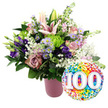 On a bright white backdrop, a celebratory 100th birthday bouquet glows with pastel charm and rich jewel tones, as if just arranged by a Canonbury florist for delivery to a beloved grandparent living near the green calm of Highbury Fields. The flowers are gathered in a modern, cylindrical vase finished in a soft, matte pink, its subtle ribbed texture adding quiet sophistication without distracting from the blooms. Towering above the arrangement are several pale pink Oriental lilies, some fully open with wide, star-shaped petals and delicate stamens, others still in long, tapered buds that hint at blossoms yet to open. Around these focal blooms nestle layers of roses in gentle blush and deeper dusty-rose hues, their velvety petals curling outward in soft spirals that suggest romance and nostalgia. Deep purple lisianthus thread through the design, their smooth petals adding depth and a touch of evening richness, while clusters of tiny lavender asters, each with a bright yellow centre, bring a playful, garden-like feel. Sprinkled throughout are lime green button chrysanthemums, their compact, rounded heads introducing a fresh, almost zingy contrast, alongside airy fronds of white baby's breath that soften and lighten the entire bouquet. Lush green foliage forms a supportive frame, balancing colour and texture while giving the arrangement a full, abundant silhouette. To the lower right, overlapping the base of the bouquet, a round foil balloon sparkles with a dense pattern of multicoloured confetti dots in red, orange, yellow, green, blue, and purple. At its centre, the bold white numerals 100, gently shadowed, stand out clearly, announcing a proud century of life or love and turning this floral display into a complete, joyful tribute.