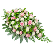 This image shows an elegant, elongated funeral spray arranged in a classic teardrop form, resting visually against a crisp white background that highlights every flower and leaf. The design is full and rounded near the top, then gradually narrows to a soft, tapering point, as if tracing the path of a gentle tear. Soft pink roses dominate the tribute, their petals layered in delicate spirals, with some blooms fully open and others just beginning to unfurl. Their tones range from the faintest blush to a deeper, romantic rose, creating a subtle variation in colour that feels tender and soothing. Threaded between the roses are pure white carnations and spray carnations, their ruffled petals adding volume and a cloud-like texture that brightens the arrangement without overpowering it. Supporting this pastel composition is a generous base of foliage: glossy, dark green leaves frame the flowers, while rounded, silver-tinged eucalyptus leaves bring a softer, misty contrast. From the pointed end of the spray, slim trails of deep green ruscus extend outward, giving the piece a natural, slightly cascading movement, as though it could have been gathered fresh from the green lanes around Canonbury and New River Walk. The overall mood is one of gentle peace and heartfelt condolence. This type of casket spray, often prepared by Canonbury Flowers for local memorial services and chapel farewells, offers a graceful way to express love, support, and remembrance when someone dear is laid to rest.